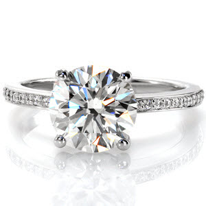 Engagement ring in Tucson with round brilliant center stone and diamond band.