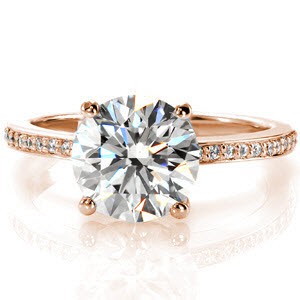 This splendid ring will look regal on any finger with its 2.00 carat round brilliant cut center diamond. The delicate band is accented with micro pavé stones on the top and sides of the center crown. The luster of the high polished band completes the look flawlessly. 