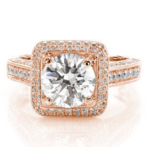 Firenze is a spectacular eye-catching engagement ring that shimmers with micro pavé diamonds from every angle. The double row of diamonds around the square shaped halo embellishes the 1.50 carat round center. The raised cathedral is suspended high above the finger for a lovely side-view. 