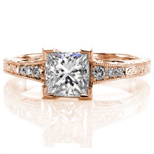 Vintage-inspired details along with a 1.00 carat princess cut center diamond make for one luxurious ring. The tapered band is detailed with hand engraving and delicate filigree curls along the side faces. The micro pavé side diamonds gradually increase in size as they frame the center.