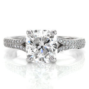 Custom engagement ring in New Haven with a bead set diamond split band and a cushion cut center diamond.