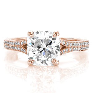 Custom engagement ring in Dayton with a bead set diamond split band and a cushion cut center diamond.