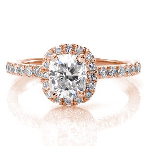 A unique, elegant ring with a V-cut micro pavé band designed to dazzle. The V-cut is a style of hand cut pavé which allows the maximum amount of light into the diamonds and results in radiant stones. This platinum ring features a 1.00 carat rectangular cushion cut center diamond set into a halo.