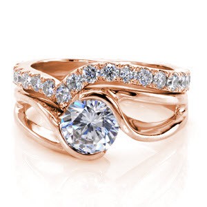 This dazzling eternity band perfectly compliments the Motion Engagement Ring. It is created to match the exact curves of the original piece and adds contrast to the high polished metal. The brilliant diamonds add glamour to the elegant design of this wedding ring set.