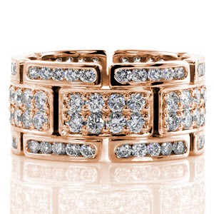 Design 2306 join stations of eight and five channel set diamonds in an arrangement of geometric style. The rectangular plaques of 14k white gold are adorned by shared prong set diamonds. Each metal edge has been rounded smooth by the perfect jewelers hand creating the utmost in comfort.