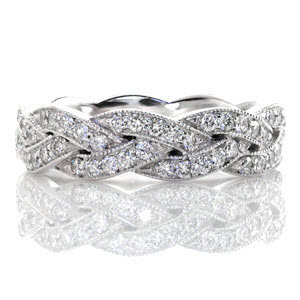 Created of seamlessly intertwining elements the Legato is elegantly braided with micro pavé diamonds. Each segment is edged with milgrain texture along the woven pattern adding dimension to the crisscross design. This unique woven band can be worn as a wedding band or a fashion ring. 