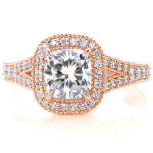 This intricate vintage-inspired design is mesmerizing with a 1.50 carat cushion cut center diamond surrounded with a dazzling halo. The design is adorned with beautiful micro pavé diamonds in every view. The side profile reveals beautifully crafted filigree, engraving and beaded embellishments.