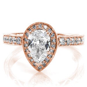The Pear Valencia is an antique inspired design with a uniquely shaped center stone. The 1.00 carat pear center diamond makes this a statement piece. The micro pavé halo and band are combined with hand engraving and filigree for a timeless feel. The edges of the band are textured with milgrain. 