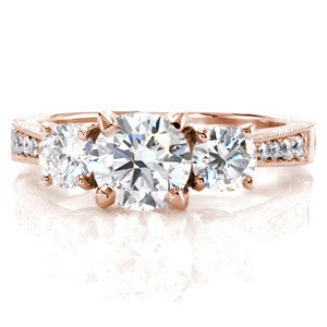 Tucson custom three stone engagement ring with a bead set diamond band and floral profile design.