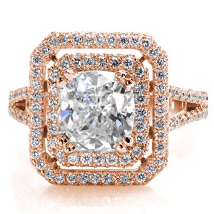 This stunning double framed halo in Design 2369 holds a sophisticated 2.00 carat cushion cut center diamond. Four split prongs mirror the gradual flare of the split shank band of diamonds. Unique details of milgrain lines decorate the beneath the halo.