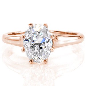 Oval Vitoria is a striking 14k white gold solitaire engagement ring. Eight prongs delicately encase the center stone drawing the eye around the oval silhouette. The 1.50 carat oval is radiantly positioned between a high-polished tapered band for a sleek finish.  