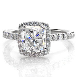 The Sarah Ann is a stunning U-cut platinum engagement ring with micro pavé diamonds. U-cut is a diamond setting style where each prong and the area around the diamond is cut out by hand. With platinum's superior strength, this method uses less metal to showcase the brilliant cushion cut diamond.  