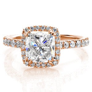 Halo engagement ring in Quebec City with a cushion cut center stone and diamond band.