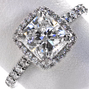 Halo engagement ring in Boston with cushion center stone and diamond band.