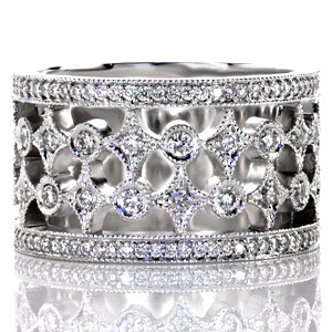 Royale is a wide band with pierced elements that create a unique and beautiful pattern. The design features rows of alternating star-bursts and circles finished with glimmering diamonds. The band is framed with rows of micro pavé diamonds that are embellished with a milgrain beaded edge.