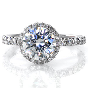 Halo engagement ring in New Orleans with a round brilliant diamond in a white gold setting.