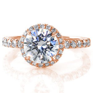 Our Riviera design captivates with the 1.50 carat round brilliant center diamond that is held in four delicate claw prongs. The diamond is framed in a classic U-cut micro pavé halo. The diamonds are repeated down the ring as well as under the center stone.  