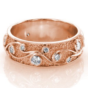 Tulsa rose gold wedding band with custom filigree curls, round diamonds and stippled background.