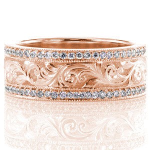 Rose gold wedding band with scroll engraved pattern between diamond bands in Allentown.