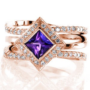 Design 2431 has two energetic bands of split bead set diamonds that frame a single high polished band in 14k white gold. The kite set natural 0.75 princess cut purple sapphire has a full bezel and outlined by a beveled square halo of bead set round diamonds.