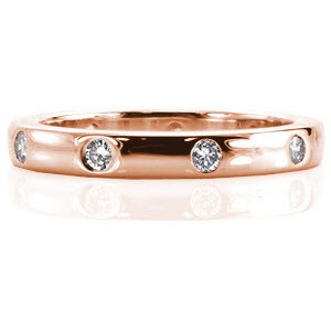 Crafted to pair next to the Aries engagement ring perfectly, the Aries Band has flush set round diamonds totaling 0.34 carats. Crafted in 14k white gold, the high polish band has flat ring faces and slightly rounded edges creating a contemporary design.