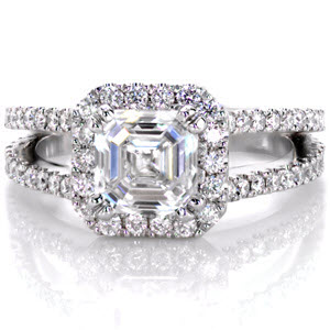 This stunning 1.25 carat asscher cut diamond dazzles within the claw prong setting. A micro pavé diamond halo encompasses the center stone for added flair. A split shank diamond band adds a delicate touch and proudly showcases the center stone. 
