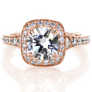 This contemporary design features a fashionable square halo and round diamond. The graduation of side stones creates a soft flare towards the top of the ring. A Euro shank is engineered to fit comfortably and prevent spinning. The surprise stones add that touch of elegance to the bottom of the band.