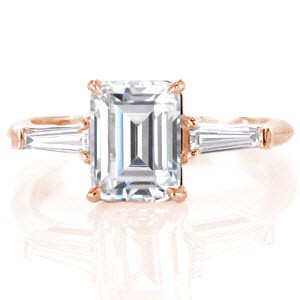 Custom rose gold engagement ring in Dallas with an emerald cut center diamond bordered by tapering baguette side stones.