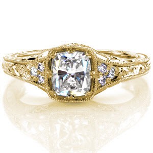 Antique inspired custom engagement ring in Schenectady with a unique cushion cut center setting surrounded by bead set side diamonds and hand engraving.