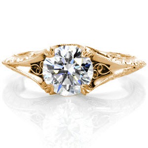 Filigree engagement ring in Quebec City with hand engraving, round center stone and milgrain detail.