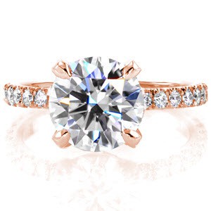 Rose gold engagement ring in Massachusetts with micro pave diamonds and round center stone.