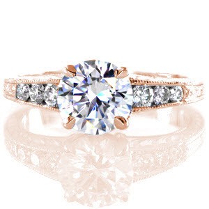 McAllen engagement ring with round brilliant center stone, hand engraving, and diamonds.