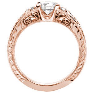 Filigree engagement ring with round brilliant center stone, hand engraving and milgrain texture.