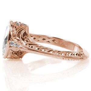 Custom rose gold engagement ring in Baltimore with an oval center diamond and a unique hand engraved knife edge band.