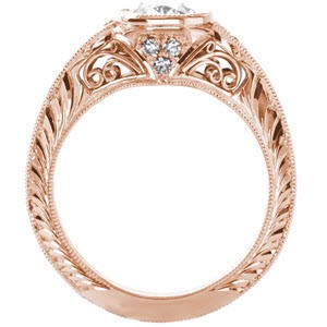 Custom rose gold engagement ring in Milwaukee with an oval center diamond and a unique hand engraved knife edge band.
