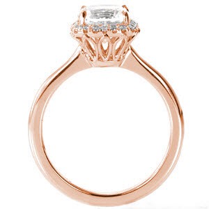 Rose gold custom engagement ring in Raleigh with a cushion cut center diamond surrounded by a diamond halo. 