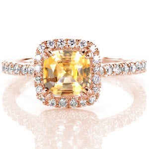 Crafted exclusively in platinum, Design 2540 exhibits a vibrant 1.20 carat yellow cushion cut sapphire. The V-cut setting of the micro pavé diamonds is hand-carved to fit each diamond and the metal area around it, creating an endless row of diamonds with superior sparkle. 