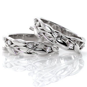 These romantic bands are alluring with the gentle motion of the leaves and vines that create the design. The bands can be worn many ways and can be used to accent a beautiful engagement ring. There are small round brilliant cut diamonds nestled among the leaves for an added touch of glamor. 