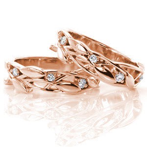 These romantic bands are alluring with the gentle motion of the leaves and vines that create the design. The bands can be worn many ways and can be used to accent a beautiful engagement ring. There are small round brilliant cut diamonds nestled among the leaves for an added touch of glamor. 