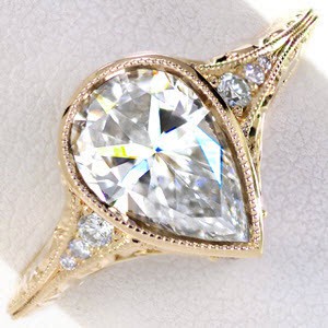 Honolulu Hawaii unique wedding ring. Shown in yellow gold with pear shape diamond..