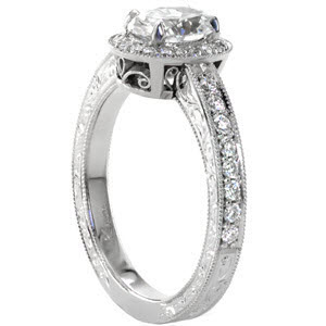 Halo engagement ring in McAllen with oval center stone, hand engraving and scroll filigree.