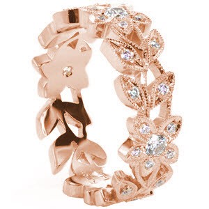 Rose gold wedding ring in Houston with nature inspired patterns, micro pave diamonds and milgrain detail.