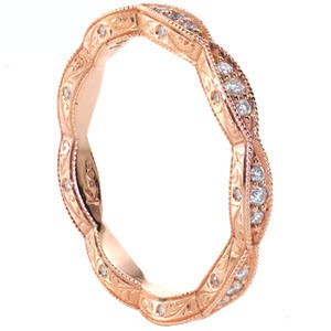 Unique rose gold wedding band in Portland. This beautiful band is delicate, but features a lot of details! This eternity band features sets of small round diamonds on the top of the band, and both sides are painstakingly detailed by hand with hand engraving and flush set diamonds.
