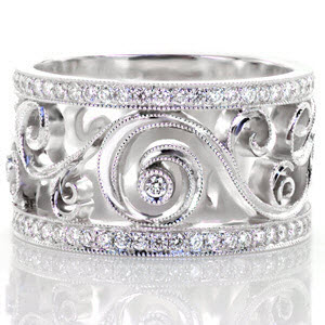 Schenectady custom wide band ring with bead set diamond rails bordering a central scroll pattern design with bezel set stones.