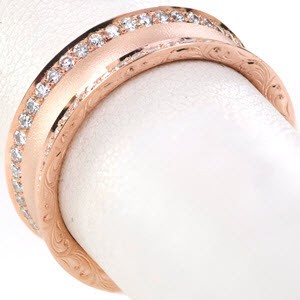Raleigh unique wedding bands with hand engraving and micropave diamonds are sure to turn heads! This stunning vintage inspired wedding band is an eternity band with hand engraving, sand blasted texture, and diamonds..