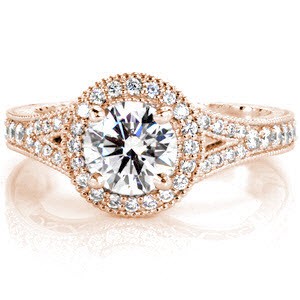 Rose gold engagement ring in Henderson with diamond halo, spit band and round center stone.