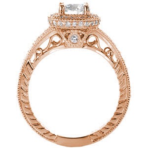 Custom rose gold engagement ring in Austin with a unique filigree profile topped with a round brilliant diamond surrounded by a diamond halo.