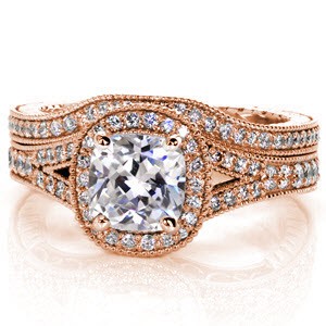 The Diana wedding band shadows the outline of the engagement ring and sits under a halo. Crafted in 14k white gold, the micro pavé diamonds adorn the top and engraving is present on all three ring sides. Graduated filigree scrolls and milgrain edging completes the vintage design.