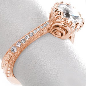 Rose gold engagement ring in Las Vegas with round center stone, micro pave diamonds and hand engraving.