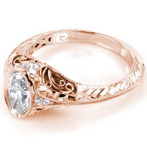 Filigree engagement ring in St. Cloud with oval center stone and half wheat engraving.